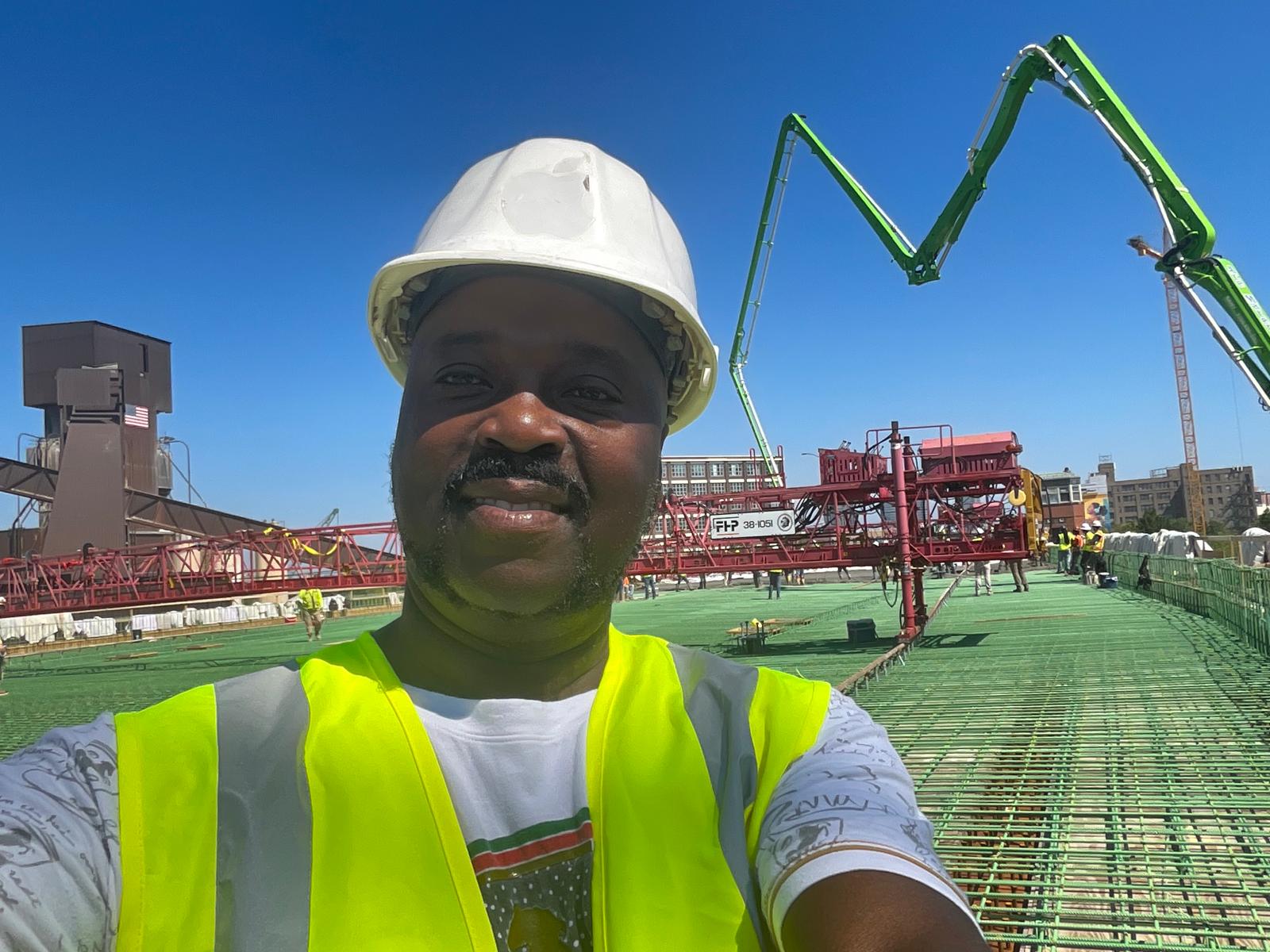 Civil engineer Moses Tumwine at an active reinforced concrete construction site